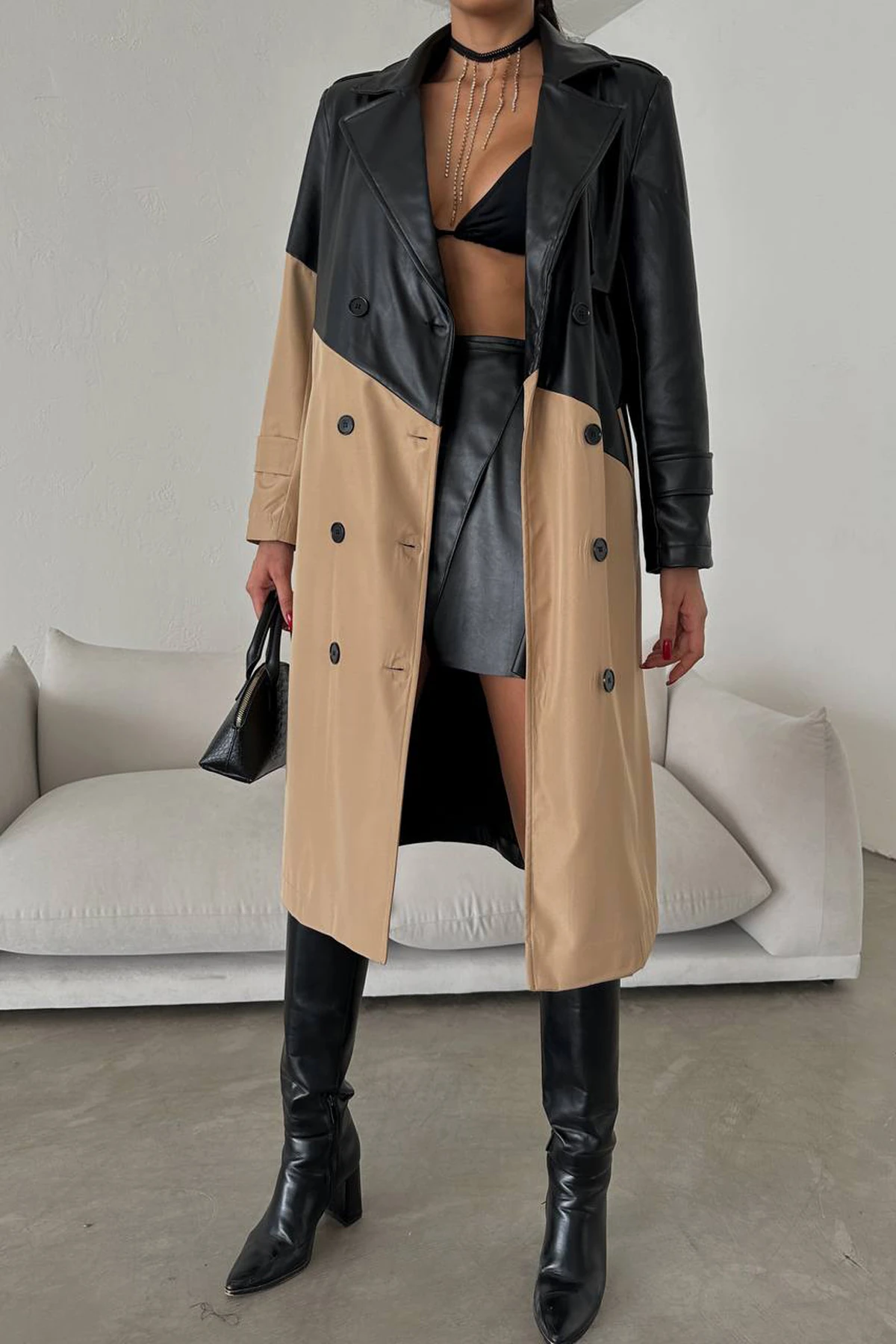 Embrace timeless luxury in this wool-gabardine and leather trench coat. A fusion of elegance and edginess for your statement style