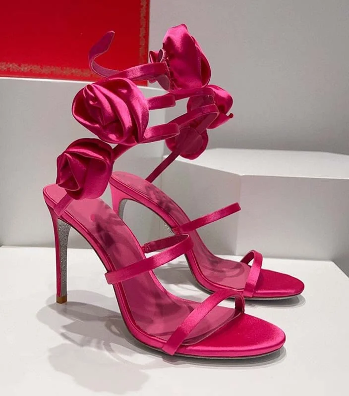 Floral heels - Satin stilettos with a charming floral detail add a touch of whimsy to your outfit.