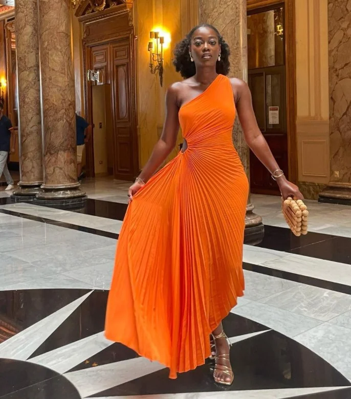 Graceful allure in our Slim-fit One-shoulder Pleated Dress – a timeless piece for a chic and sophisticated wardrobe statement.
