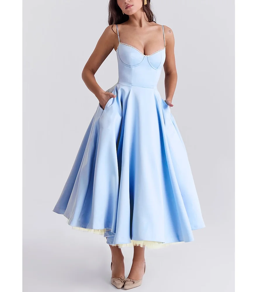 Elegant V-neck sleeveless puffy long dress with a sophisticated silhouette, ideal for a glamorous fall event.