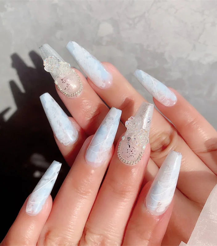 Extra-long artificial ice blue bride nails, a stunning choice for a bridal look. Enhance your nail health while staying on-trend in 2024.