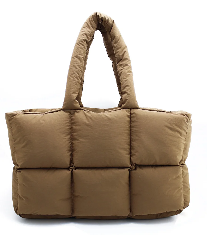 Carry your essentials in style with the Cotton Puffer Tote Bag. A blend of comfort and chic, this accessory complements your everyday opulence effortlessly.