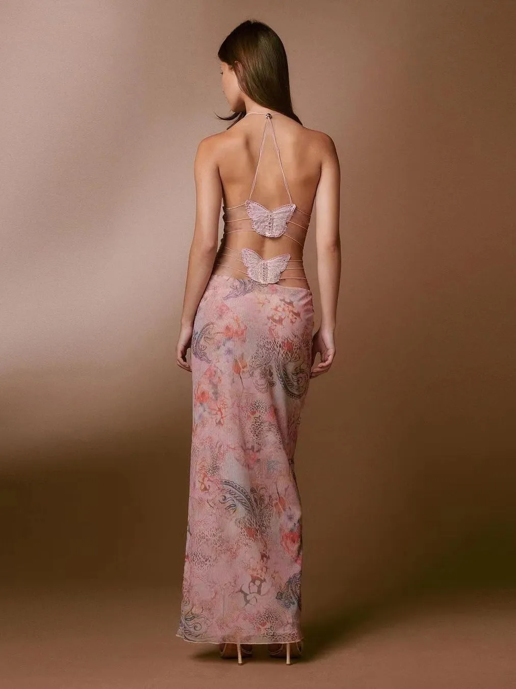 A stunning backless butterfly halter dress with spaghetti straps, perfect for a stylish summer ensemble. Embrace elegance and beauty with this eye-catching outfit