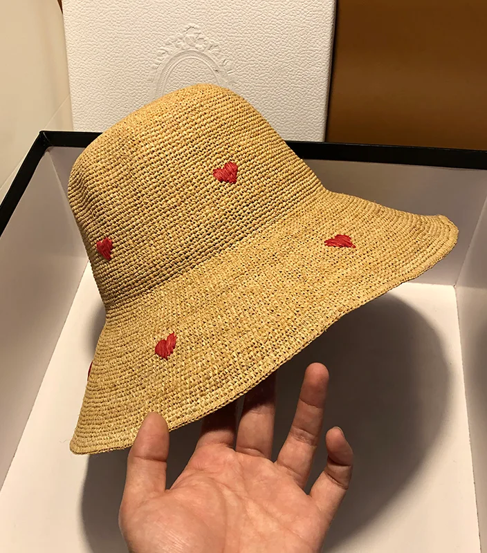Add a touch of elegance to your summer outfit with our Sweetheart Breeze Raffia Hat. Stay cool and chic under the sun. Shop now!