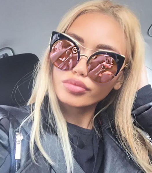 Illuminate your style with these cat-eye sunglasses featuring a reflective glow. A sleek accessory that adds an edge to any look, day or night.
