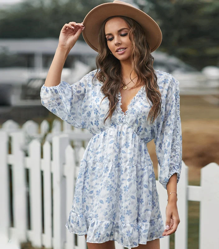 Floral V-neck dress with butterfly sleeves, offering a romantic and airy look perfect for spring and summer occasions.