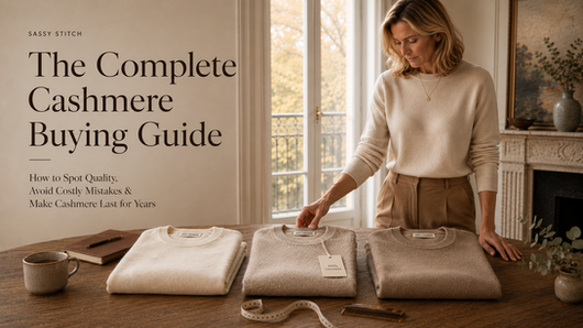 Woman comparing three cashmere sweaters while choosing the best quality knitwear for a complete cashmere buying guide.