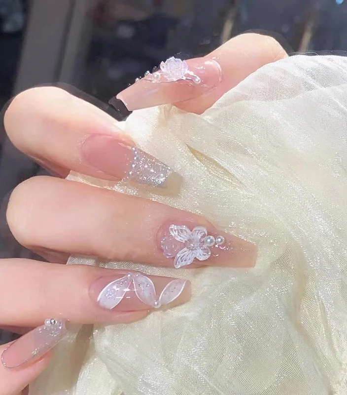 Extra-long artificial bride nails, perfect for a glamorous bridal look. Keep your nails healthy and stylish with these trendy 2024 nail designs.