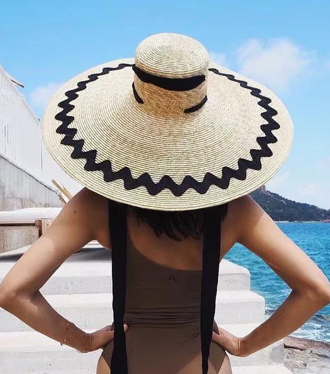Complete your summer look with our Breezy Waves Adjustable Straw Sun Hat. Stay cool and stylish all season long. Shop now!