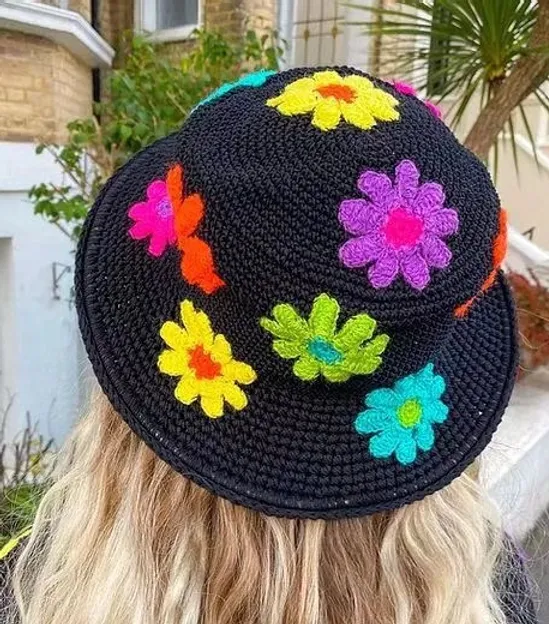 Bohemian Flair for Sunny Days: Blossom Breeze Crochet Boho Hat features a beautiful crocheted design and blooming details, perfect for adding a touch of bohemian style and sun protection to your summer adventures.