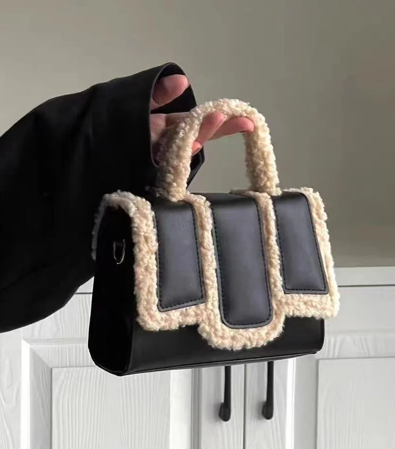 Luxury Defined: Black Lamb Wool Crossbody Bag - Elevate your accessories game with this luxurious and versatile crossbody bag. ⚫👜