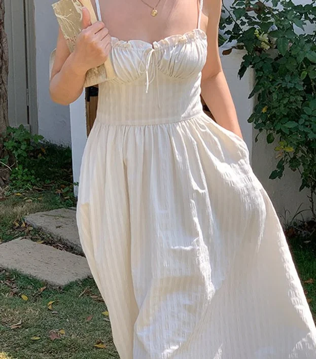 Timeless elegance in our White Strap Dress – a chic and versatile wardrobe essential for a sophisticated and stylish look.