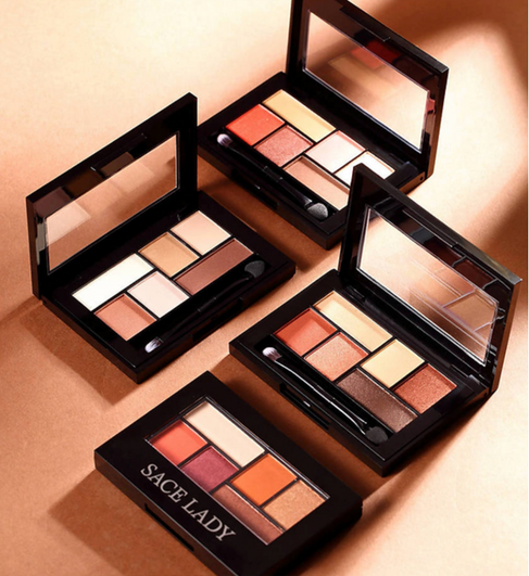 Compact and matte portable makeup palette for on-the-go beauty solutions.
