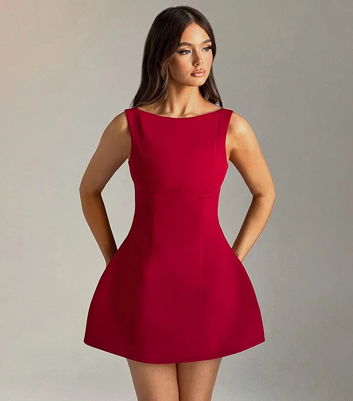 Sleeveless, backless mini dress in a chic summer style. Perfect for warm weather events or a touch of sophistication on a date night.  pen_spark