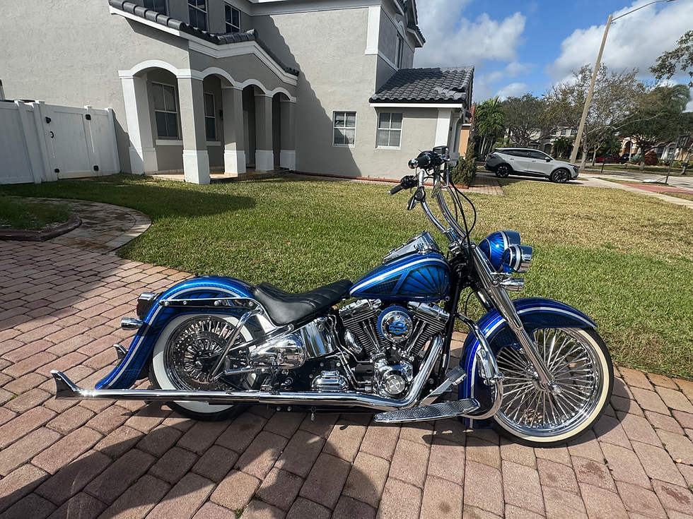 Custom red Harley bagger in the shop
