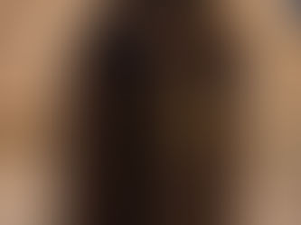 Rustic wooden door with a number 4 in a yellow frame. Stone archway and navy wall background. A basket hangs above the slightly open door.