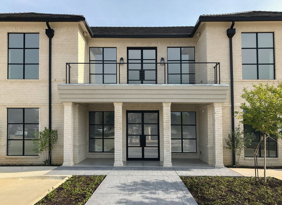 Commercial building with custom iron and glass entrance