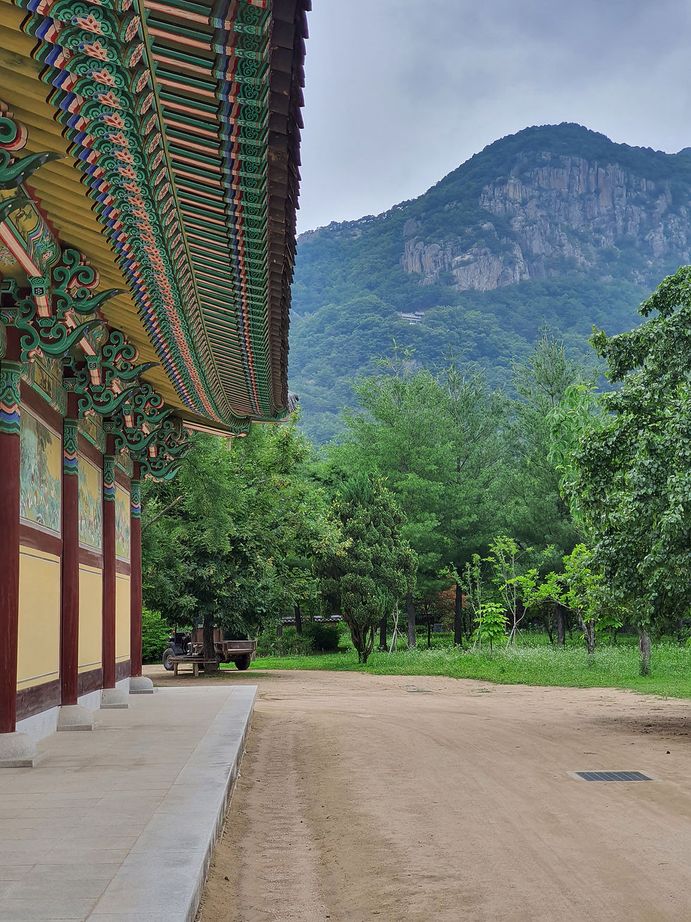 colorful painting on the building and rocky mountain at the background