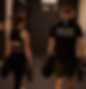 athletes are walking in a gym