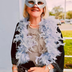 Image 8 Sonja Ridden resplendent in feathers made a grand entrance.png