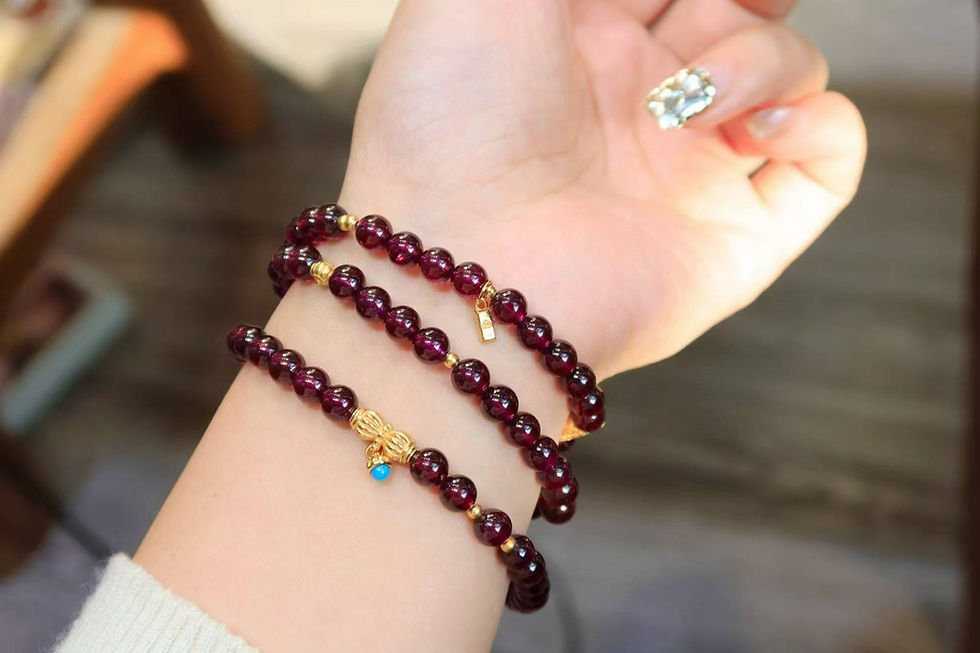 Thumbnail: garnet bracelet worn on wrist layered style jewelry