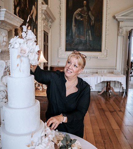 Jan Finn setting up wedding cake