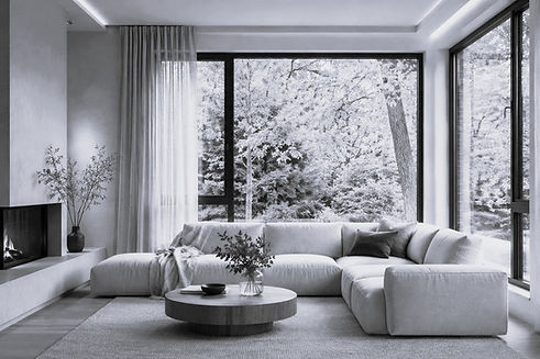 Modernes Wohnzimmer mit energieeffizienten Fenstern als Beispiel für eine BAFA Förderung für Fenster im Rahmen einer energetischen Sanierung.