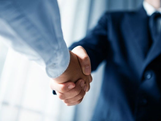 two people shaking hands