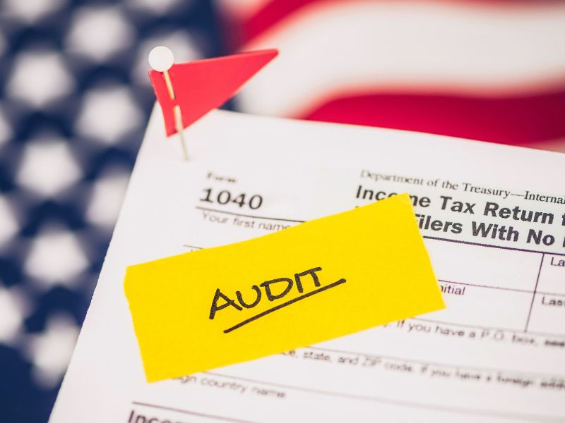 tax form with a yellow "audit" sticker on it