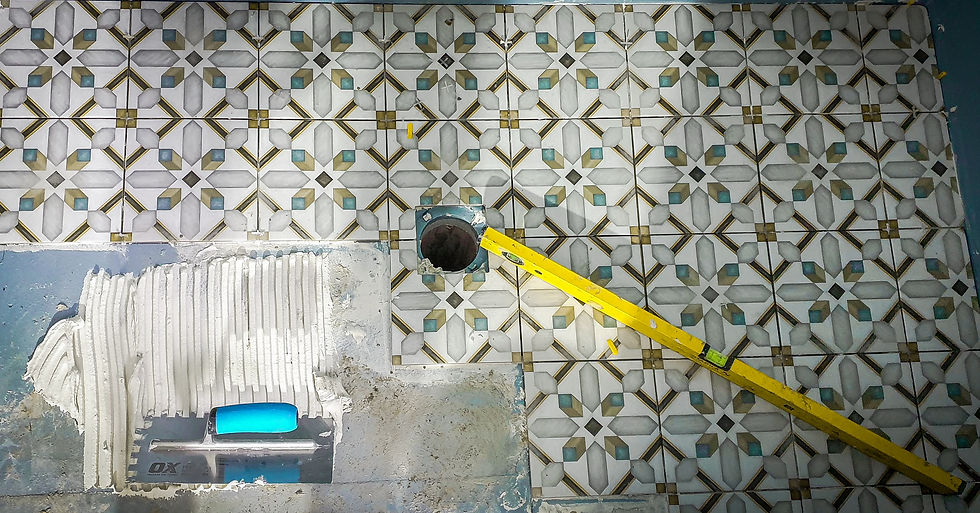 Close-up view of a tiled bathroom wall with precise grout lines