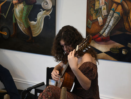 A guitar student performing in a recital