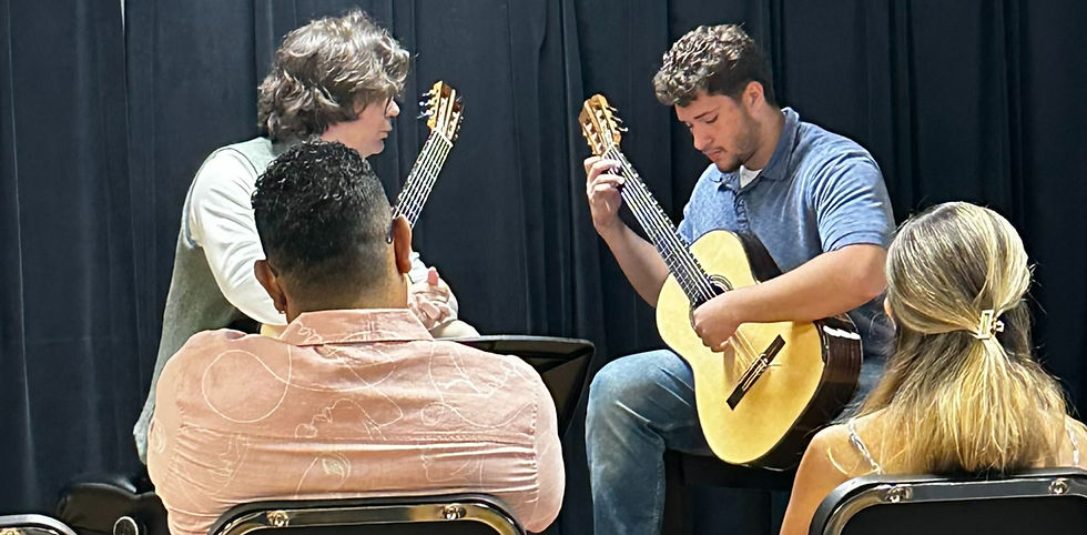 student plays for Alberto Puerto at masterclass at New World School of the arts in 2026