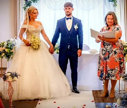 In quiet closeness, she leans into him—soft light and sketches behind them, a moment of st