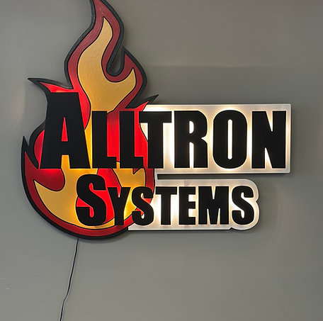 Alltron Systems' logo hanging in Alltron Systems office.