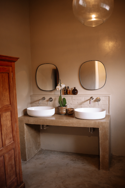 His and Hers basins, spoap, cream and make up towels.