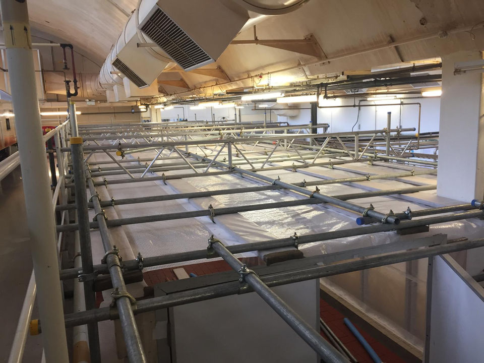 Temporary scaffolding screen enclosure for dust protection during factory floor replacement work