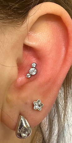 Conch and lobe ear piercings with professional jewellery — Piercing by Jooles Montrose