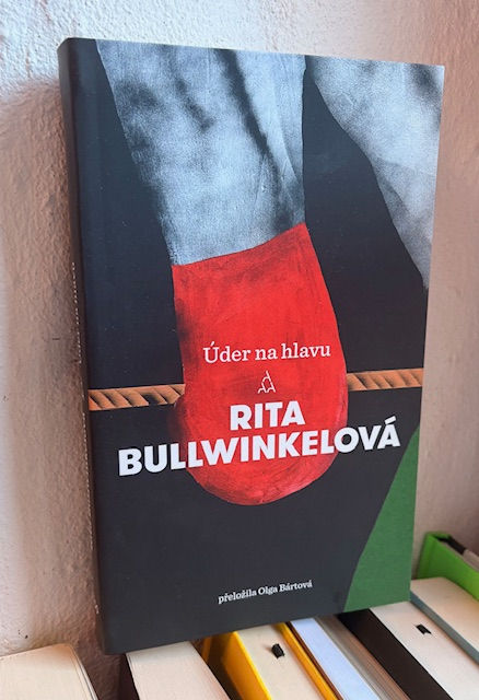 Úder na hlavu; Rita Bullwinkelová