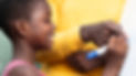 close-up-smiley-kid-writing-board.jpg