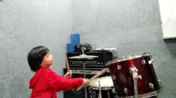 Rudra plays drum