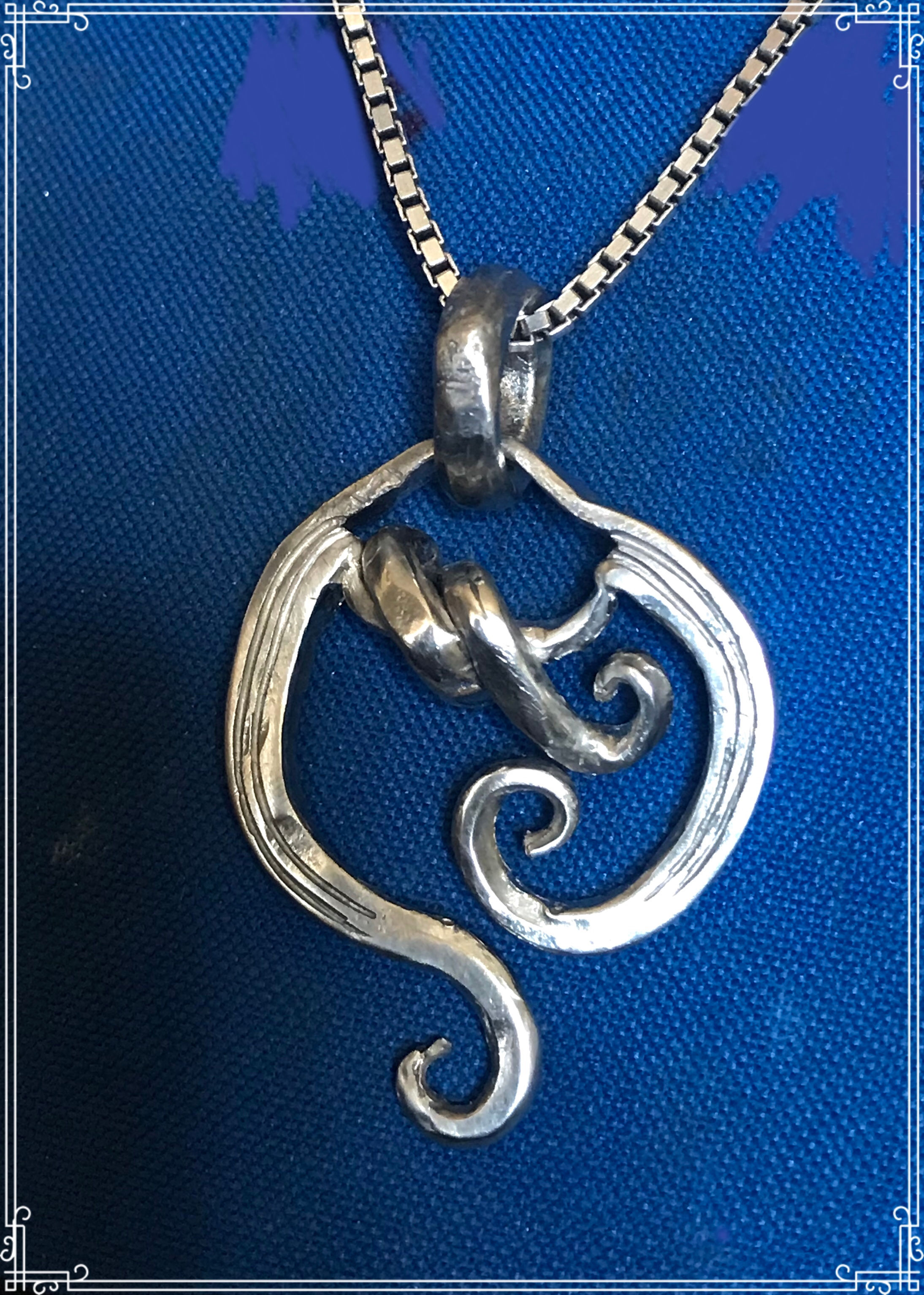 Sterling wrapped Scroll pendant 