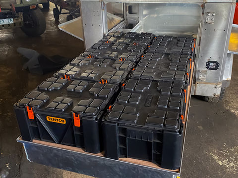 Slide-out drawer extended, showcasing storage space with packed ammo boxes.