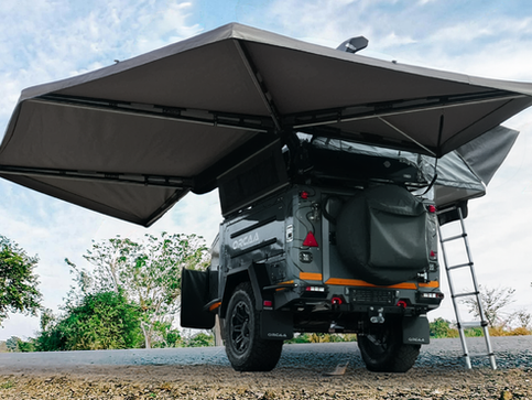 A wide low-angle view of the ORCAA 270° Awning fully deployed, showing the massive 13.8 square meters of wrap-around shade coverage.