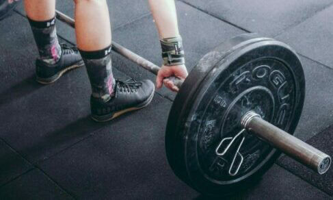 lifting up weight at gym - different types of shoes to pack for uni