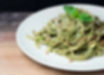 Pesto spaghetti with basil on top