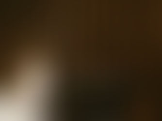 student in front of computer stressed and holding head