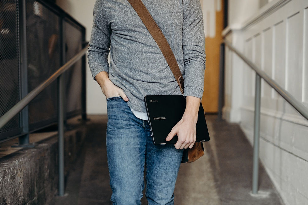 man with laptop bag hero image