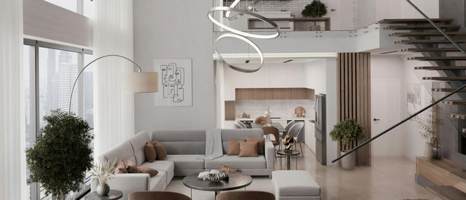 Salon moderne italien 2026 avec canapé blanc et coussins marron clair, sol en marbre beige, cuisine ouverte en blanc et bois clair à l’arrière, luminaire suspendu argenté, ambiance élégante et lumineuse.