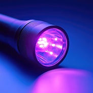 Photo of a UV flashlight (cropped to square dimensions).jpeg