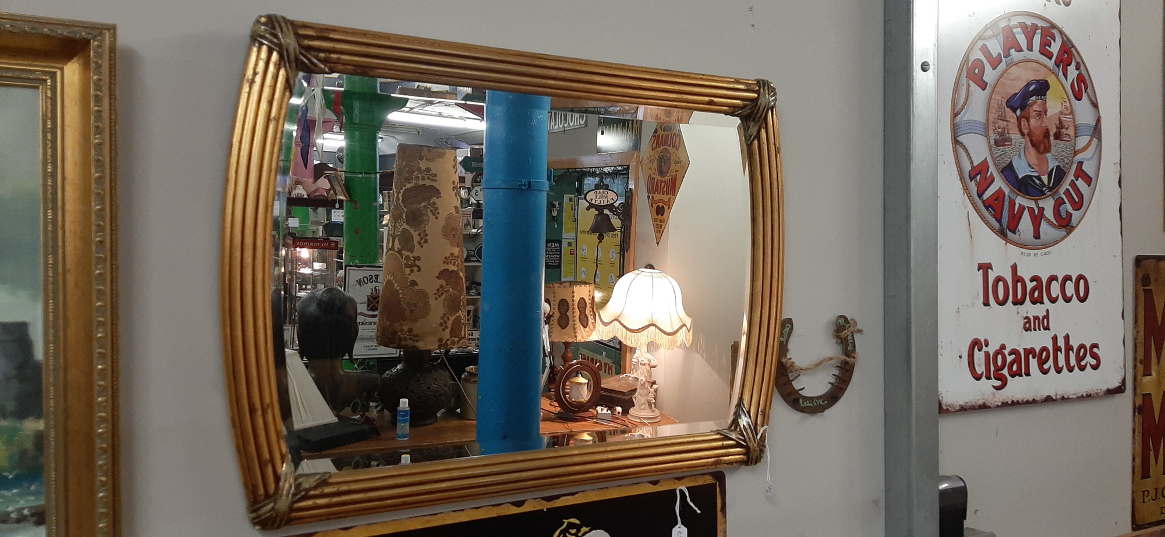 Rectangular Gold Colored mirror.